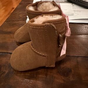 UGG Jesse Bow ll Baby Booties with Pink Bow